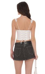 Low Rise Polka Dot Denim Mini Skirt in Faded Black